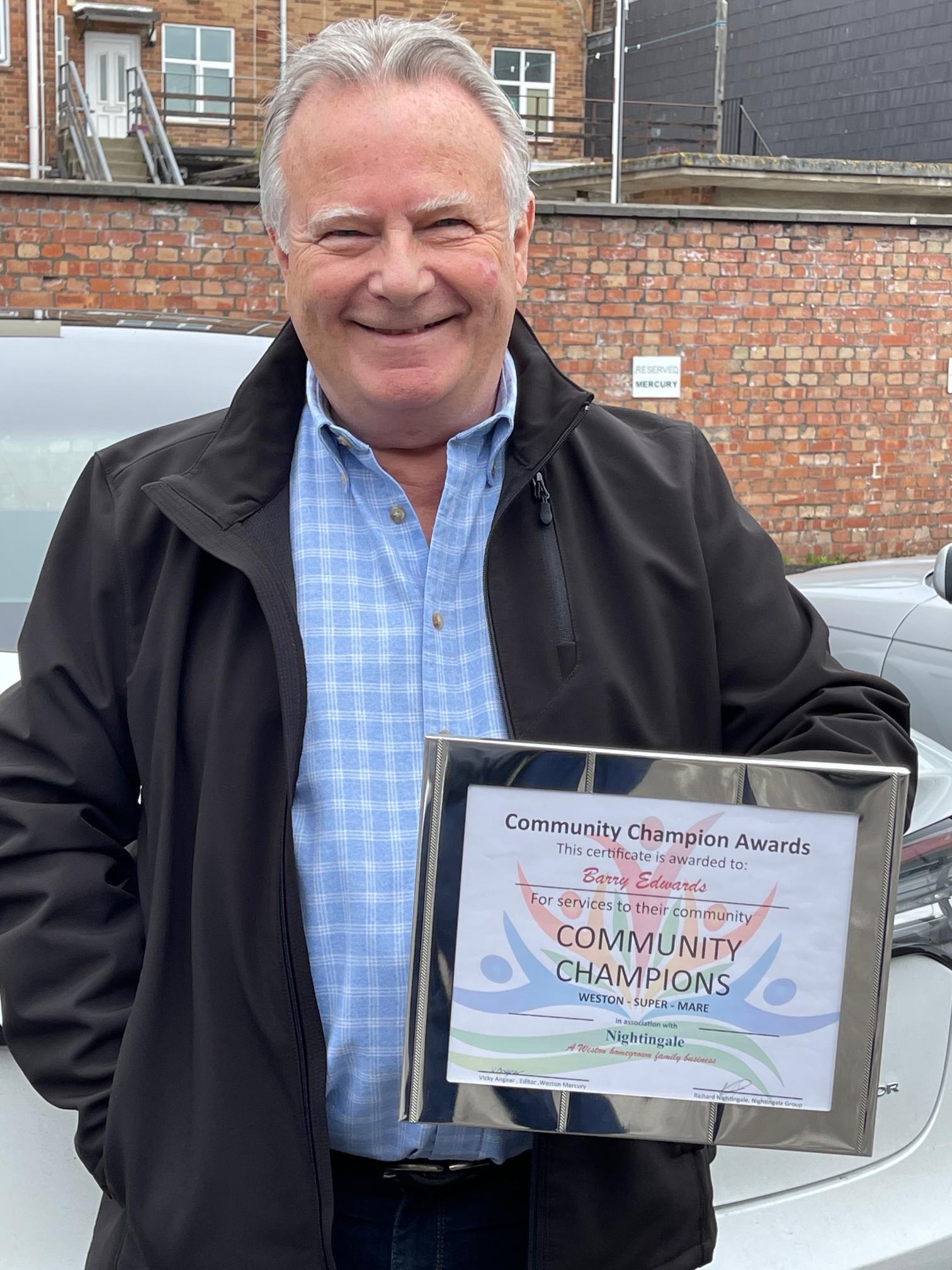 Barry receiving his Community Champion Award from Richard Nightingale