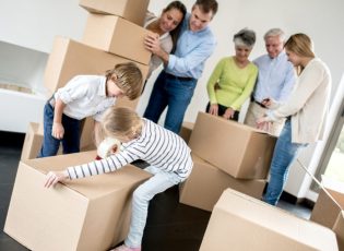 TWicks Family moving house and packing in boxes